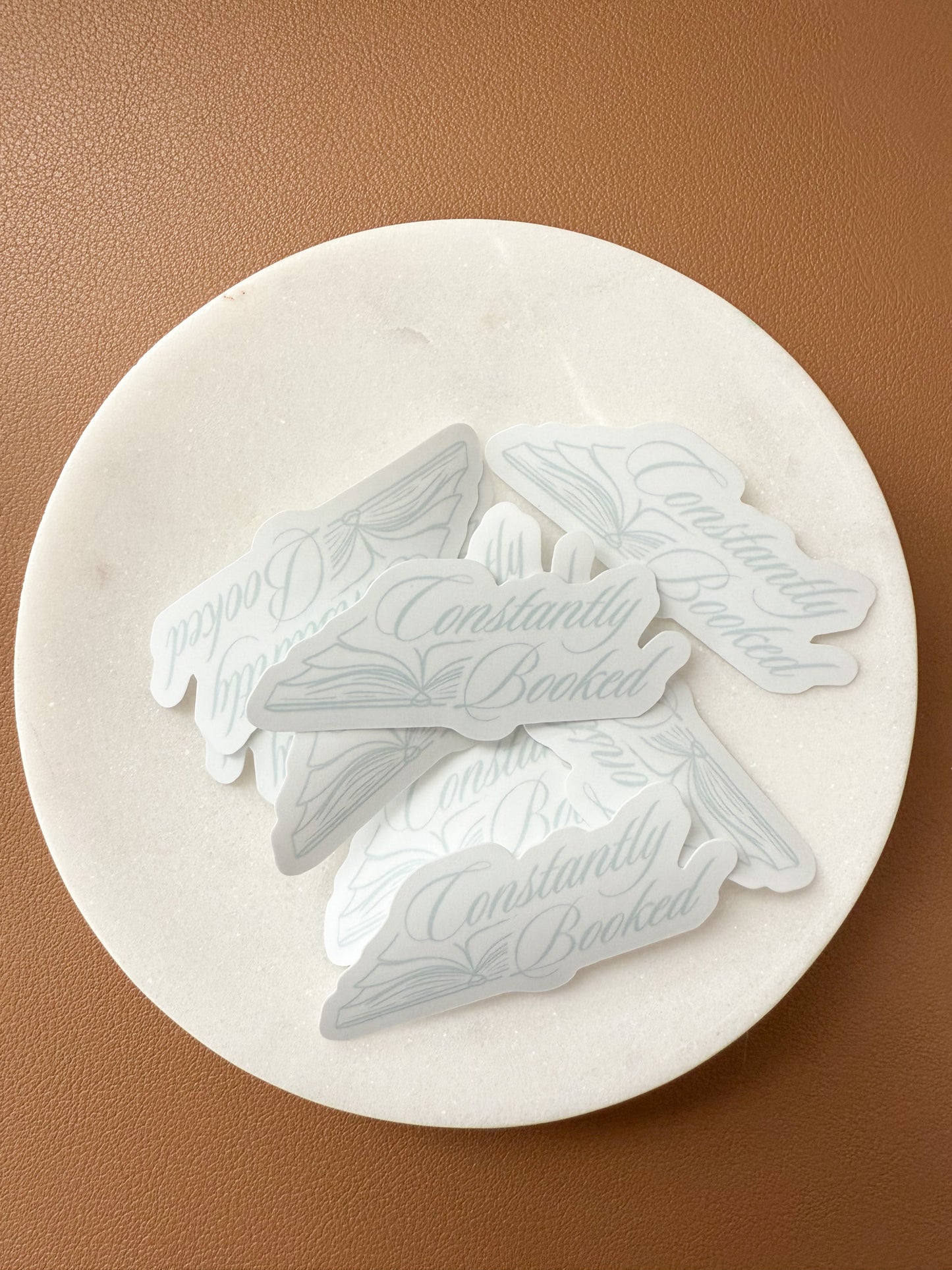 Constantly Booked Sticker